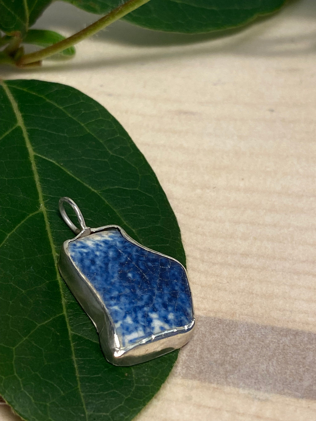 Blue and white sea pottery and sterling silver pendant