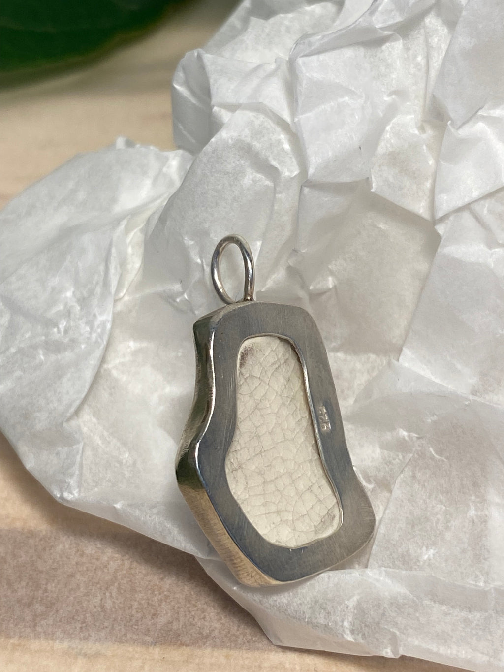 Blue and white sea pottery and sterling silver pendant