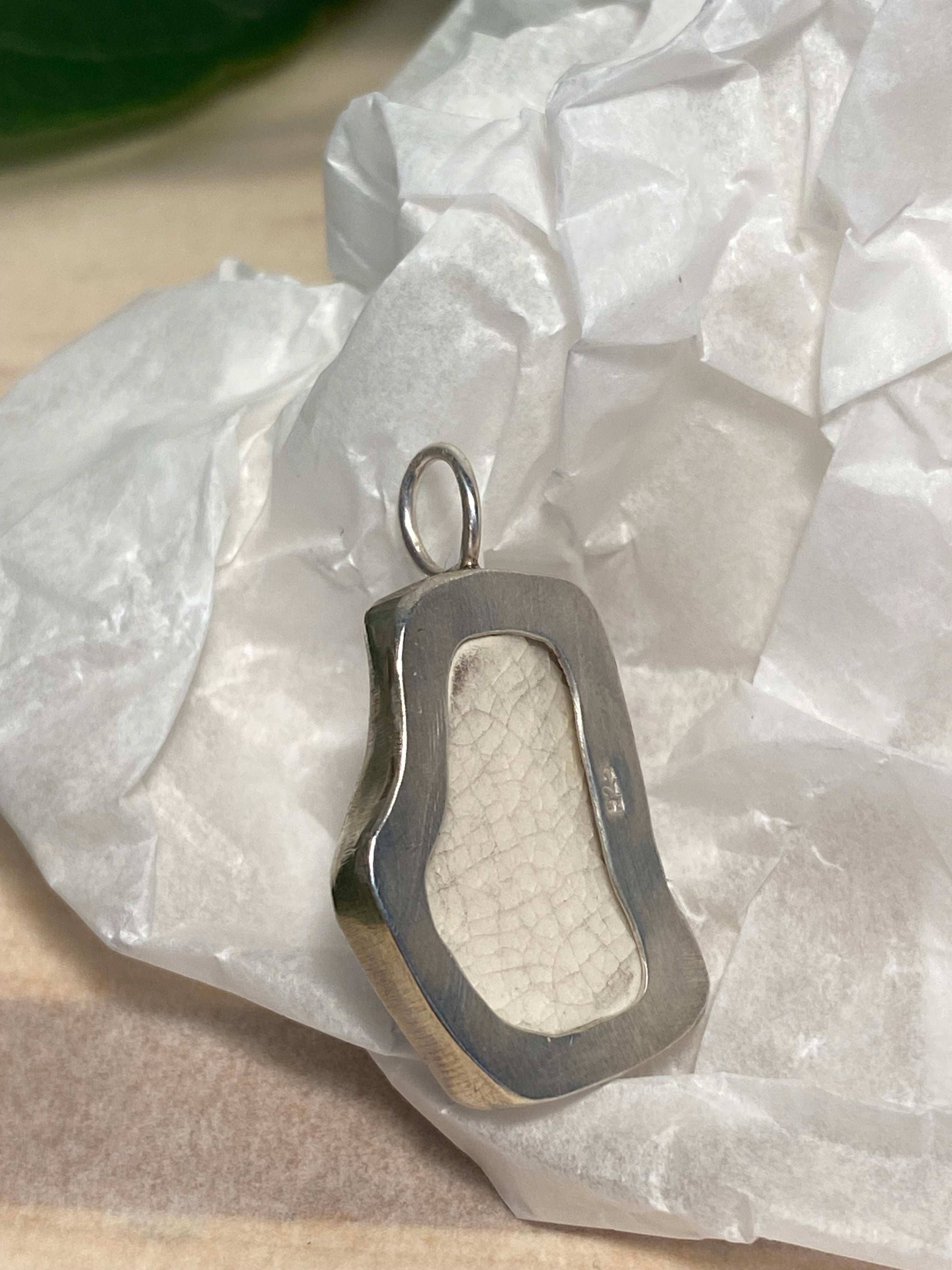 Blue and white sea pottery and sterling silver pendant
